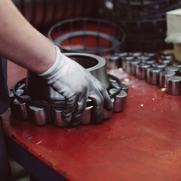 Industrial barrel bearing assembly and service Mechanic assembling large industrial bearing.